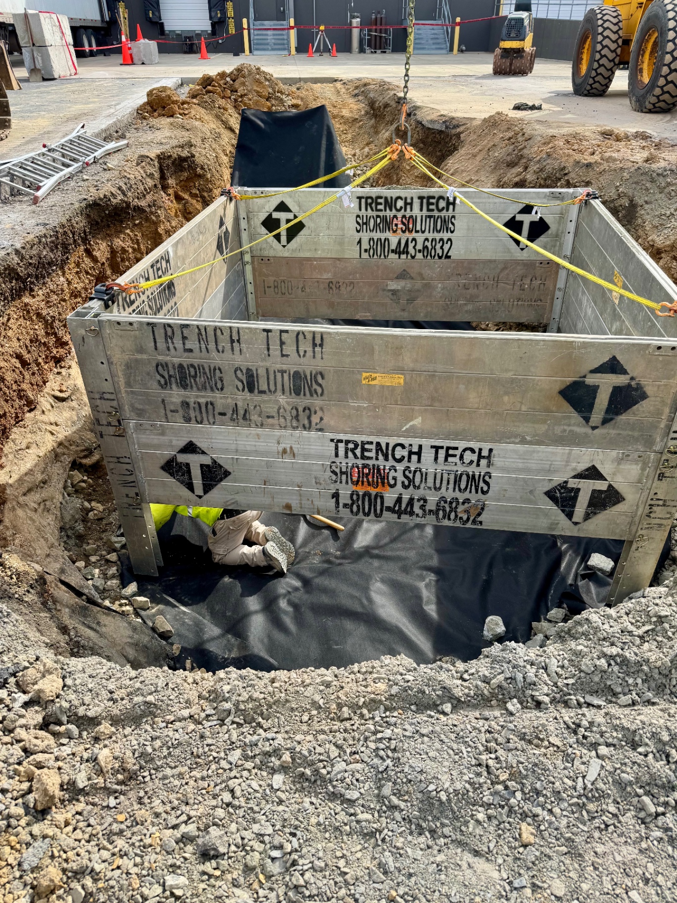 Excavator working a foundation cut on a residential build site